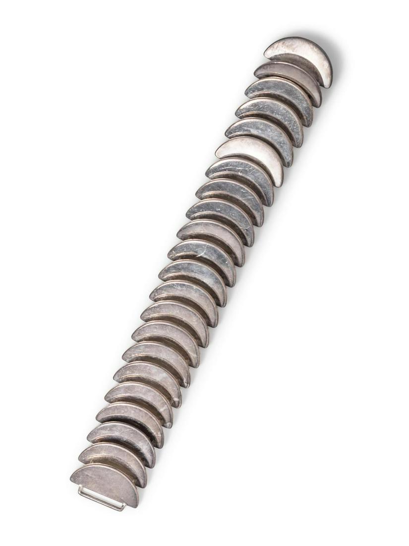 A Sterling Silver Bracelet, Astrid Fog for Georg: A Sterling Silver Bracelet, Astrid Fog for Georg Jensen, consisting of overlapping semicircle links. Stamp: (maker's mark) 925 S DENMARK 169. 83.00 dwts. Provenance: