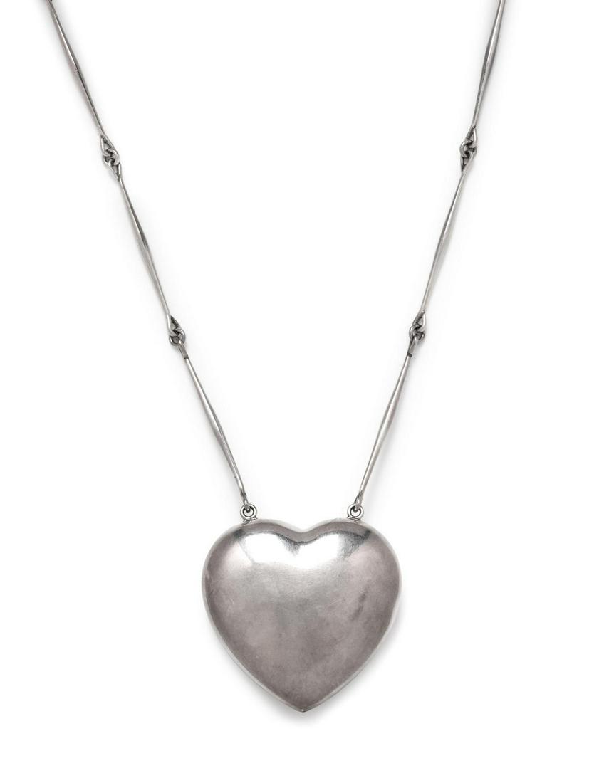 A Sterling Silver Heart Necklace, Astrid Fog for Georg: A Sterling Silver Heart Necklace, Astrid Fog for Georg Jensen, consisting of a puffed heart pendant suspended from a bar link longchain necklace. Stamp: (maker's mark) 925 S DENMARK 126. 60.70 dwts. P