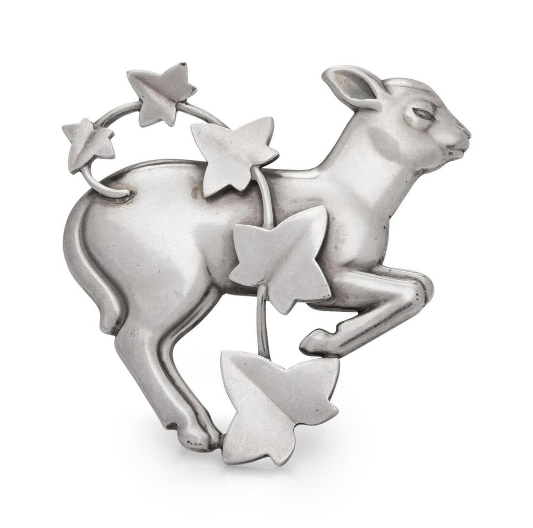 A Sterling Silver Brooch, Arno Malinowski for Georg: A Sterling Silver Brooch, Arno Malinowski for Georg Jensen, designed as a lamb with ivy. Stamp: (maker's mark) 925 S DENMARK 311. 10.00 dwts. Provenance: