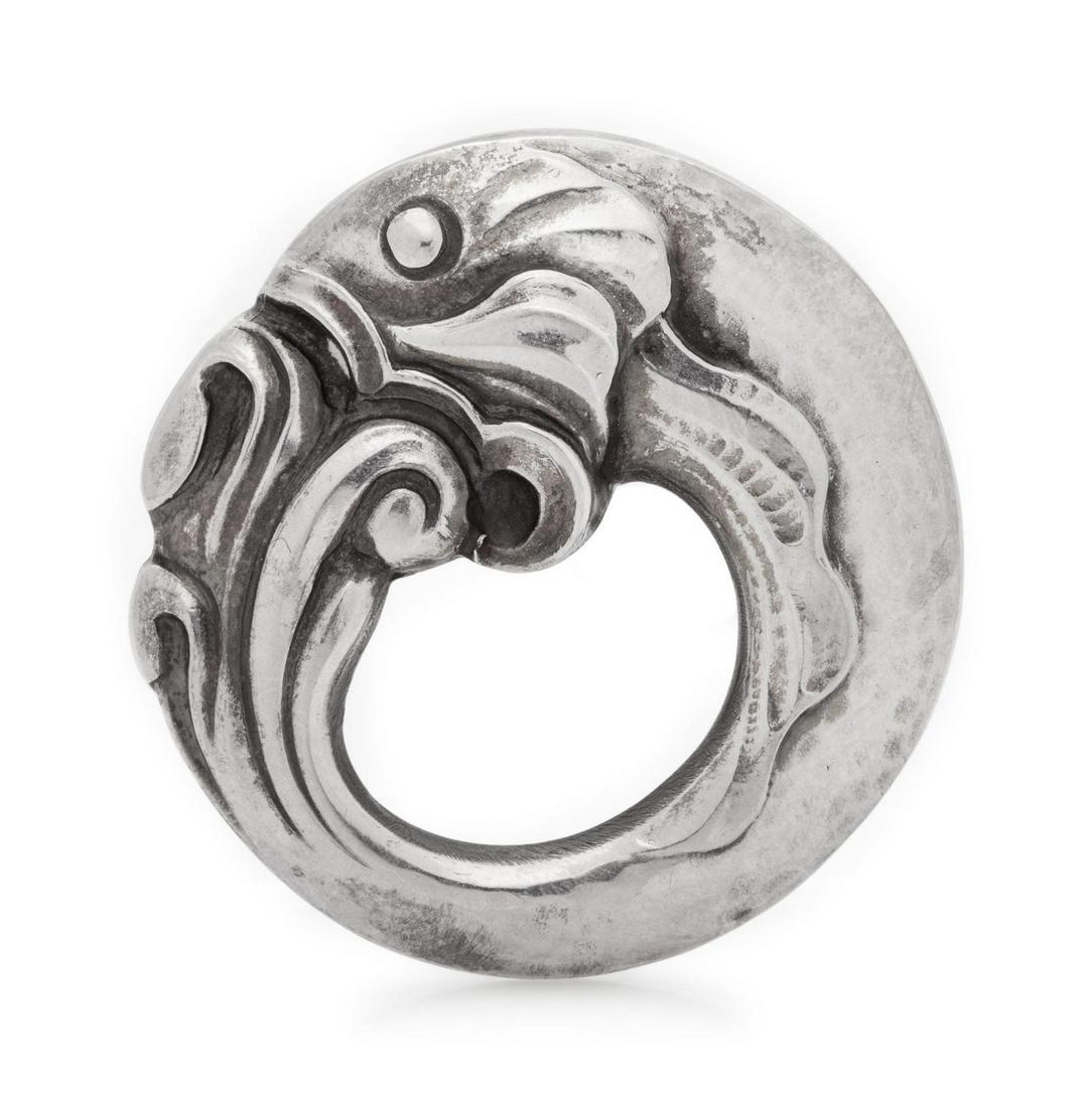 A Sterling Silver Brooch, Georg Jensen,: A Sterling Silver Brooch, Georg Jensen, designed as a stylized curving fish. Stamp: 925 S (maker's mark) 10. 4.20 dwts. Provenance: