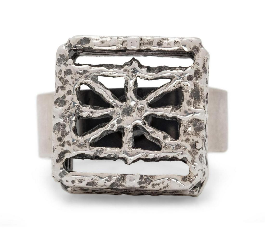 A Silver Ring, Pentti Sarpaneva,: A Silver Ring, Pentti Sarpaneva, consisting of an open textured cube design. Stamp: P. SARPANEVA (Finnish hallmarks) FINLAND. 7.65 dwts. Provenance:
