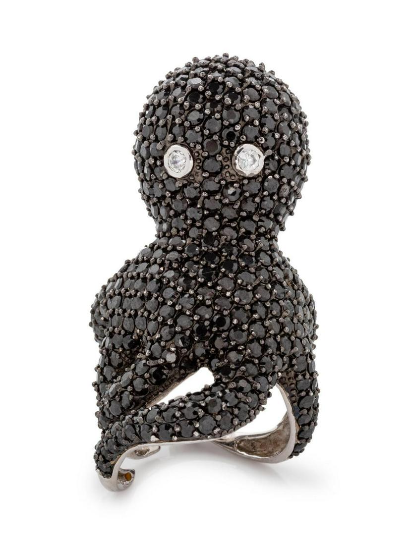 A Silver, Black Diamond and Diamond Octopus Ring,: A Silver, Black Diamond and Diamond Octopus Ring, containing numerous round mixed cut black diamonds measuring approximately 1.50-1.80 mm in diameter and two round brilliant cut diamond eyes weighing 