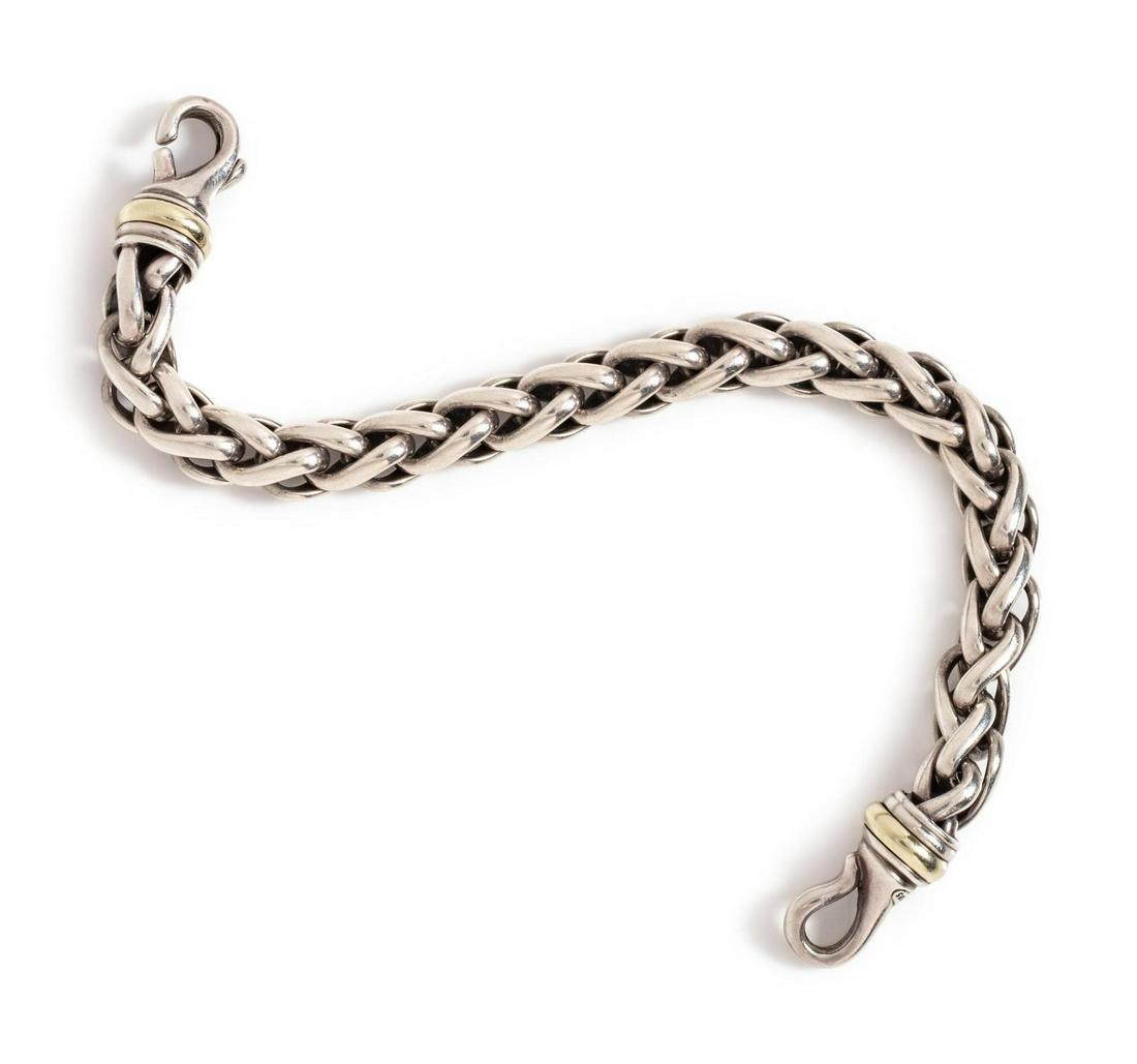 A Sterling Silver and 14 Karat Yellow Gold Bracelet,: A Sterling Silver and 14 Karat Yellow Gold Bracelet, David Yurman, consisting of a wheat chain measuring approximately 8.00 mm wide. Stamp: 925 D.Y. 585. 29.00 dwts. Provenance: