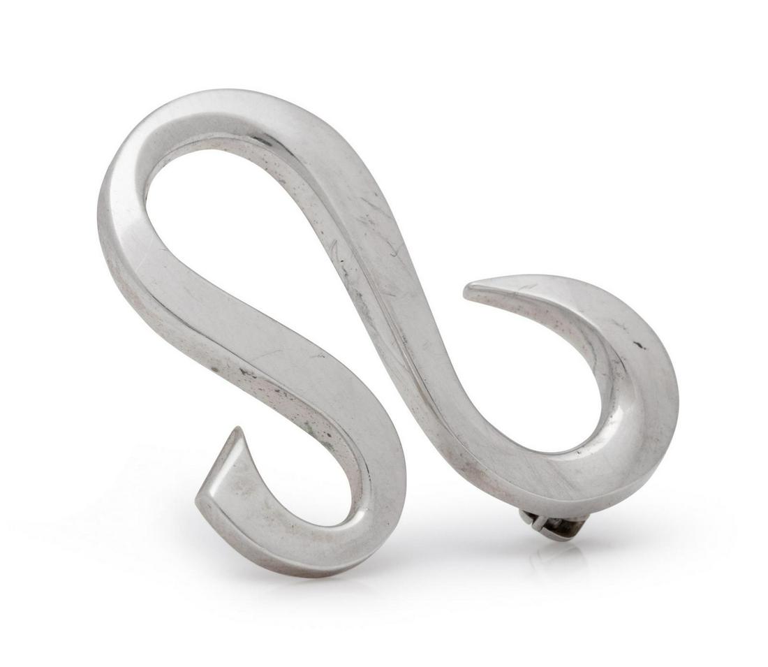 A Sterling Silver Brooch, Paloma Picasso for Tiffany &: A Sterling Silver Brooch, Paloma Picasso for Tiffany & Co., consisting of a curving line motif. Stamp: TIFFANY & CO. 925 Paloma Picasso. 2.45 dwts. Provenance: