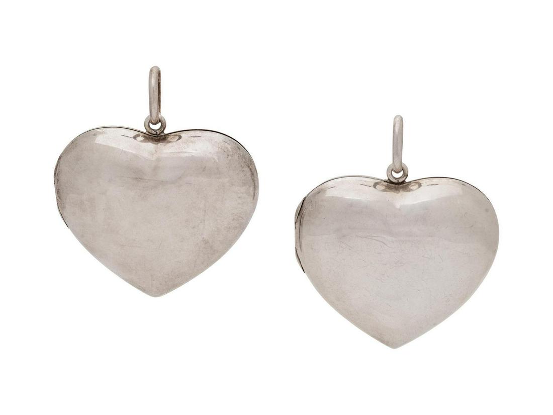 A Collection of Sterling Silver Heart Lockets,: A Collection of Sterling Silver Heart Lockets, consisting of two puffed heart locket pendants with hinged openings. Stamp: 925. Stamp: 925. 37.95 dwts. Provenance: