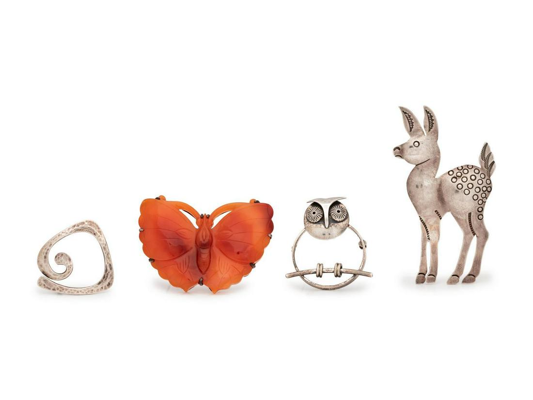 A Collection of Silver Brooches,: A Collection of Silver Brooches, consisting of a butterfly brooch containing carved carnelian, a sterling silver deer brooch, a sterling silver owl brooch signed Beau, together with a hammered finish 