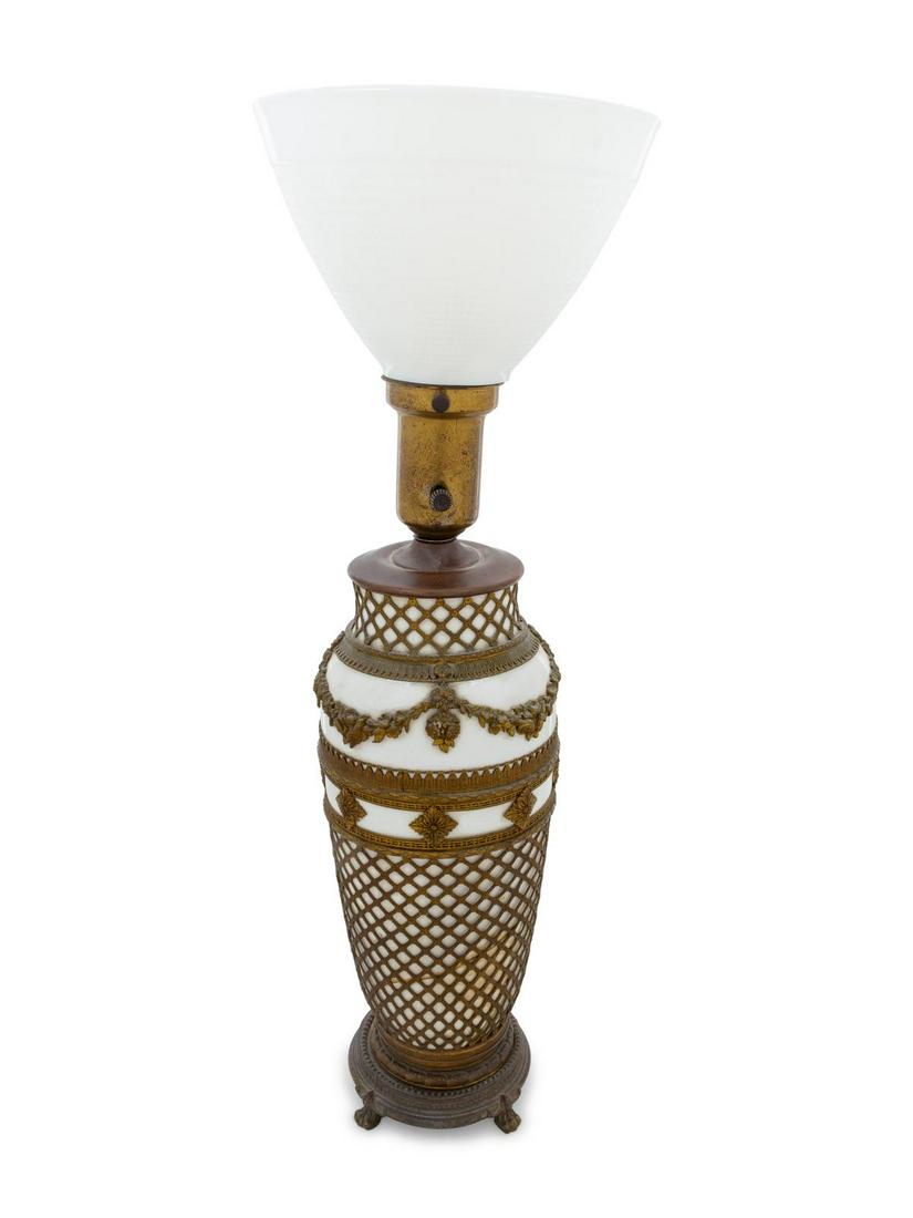 A French Gilt Metal Mounted Glass Lamp: A French Gilt Metal Mounted Glass Lamp Height of glass 13 1/2 inches. Property from the Estate of Commander Karl E. Stein and Flora M. Stein, Chicago, Illinois