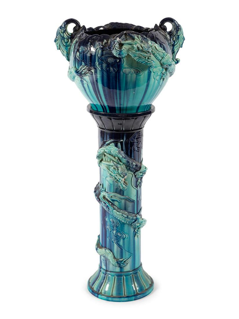 A Majolica Jardiniere on Stand: A Majolica Jardiniere on Stand Late 19th/Early 20th Century modeled to show writhing dragons throughout. Height 36 inches. Property from the Collection of Howard Kornacki and Sebastian Reyes, Evanston
