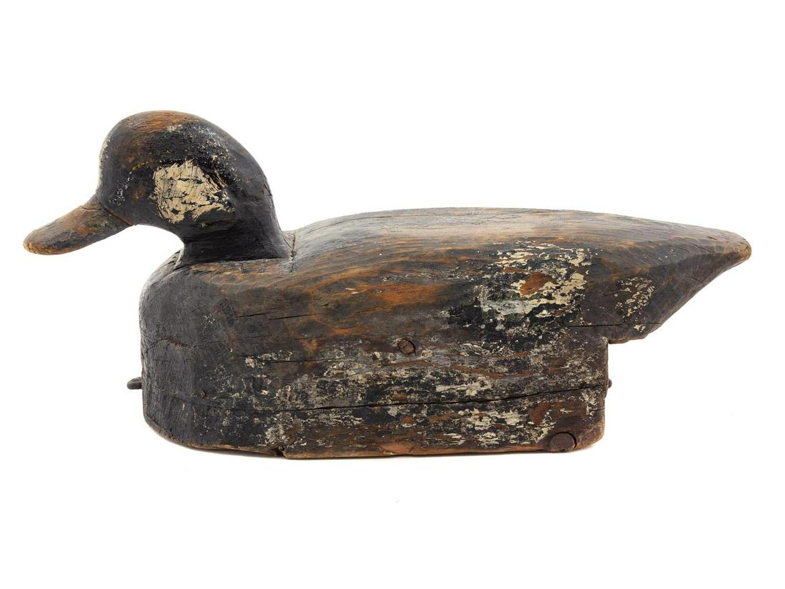A Painted Wood Duck Decoy: A Painted Wood Duck Decoy Length 9 inches. Property from the Collection of Jonathan Hoffman, Chicago, Illinois