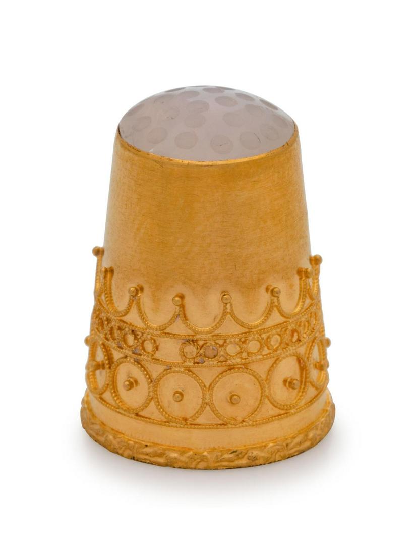 A Swedish 14-Karat Yellow Gold and Moonstone Thimble: A Swedish 14-Karat Yellow Gold and Moonstone Thimble Maker's Mark FH, 19th Century having a moonstone-inset cap, the body decorated with filigree tracery. marked on interior Height 7/8 inch. Property 