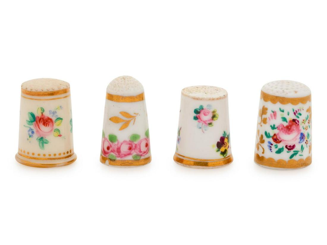 Four English Painted and Parcel Gilt Porcelain Thimbles: Four English Painted and Parcel Gilt Porcelain Thimbles 19th Century each decorated with polychrome floral sprays and gilt bands. Height of tallest 7/8 inch. Property from the Collection of Ann Blakes