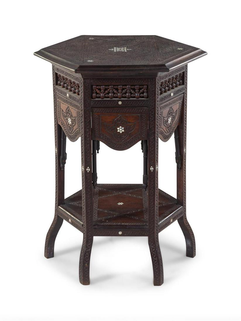 A Syrian Carved and Mother-of-Pearl Inlaid Table: A Syrian Carved and Mother-of-Pearl Inlaid Table Late 19th/Early 20th Century Height 31 x width 24 x depth 21 inches. Property from the Collection of Hamid and Kim Alwan, Milwaukee, Wisconsin