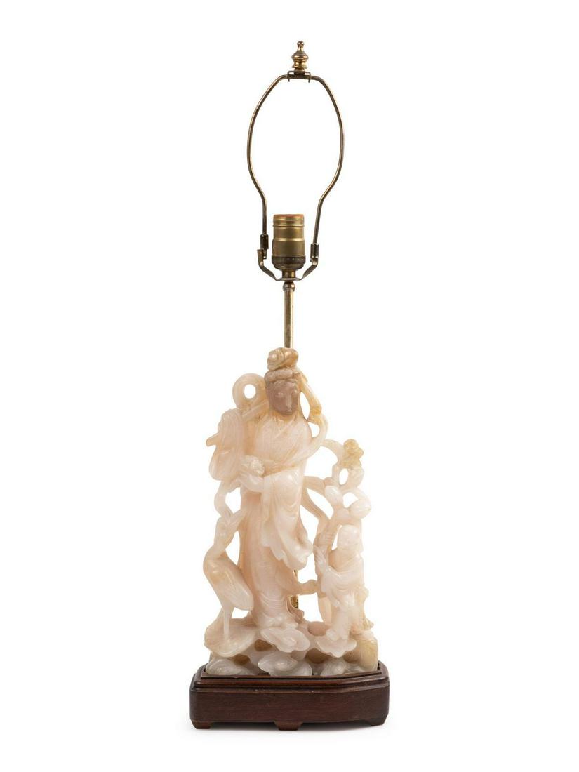 A Chinese Carved Soapstone Figure Mounted as a Lamp: A Chinese Carved Soapstone Figure Mounted as a Lamp Height 12 3/4 inches.