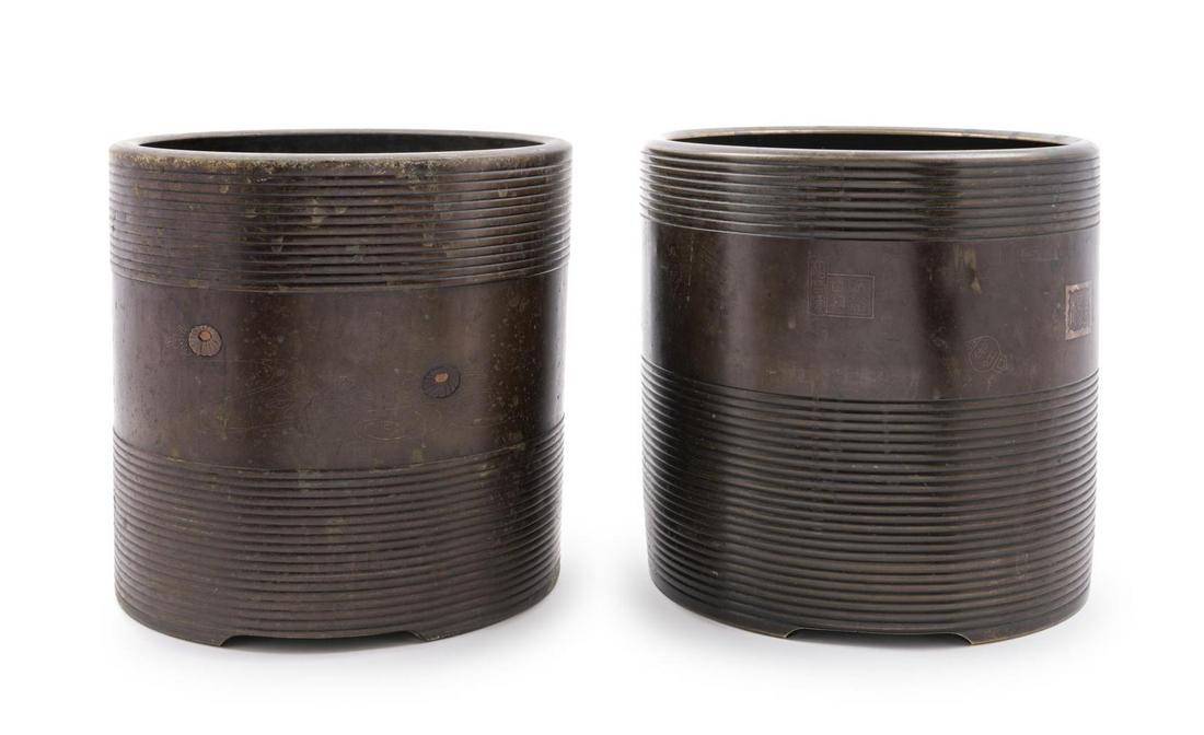 A Pair of Japanese Bronze Cylindrical Cachepots: A Pair of Japanese Bronze Cylindrical Cachepots Height 9 1/4 x diameter 9 3/4 inches. Property from the Estate of John Spencer, Rhinelander, Wisconsin