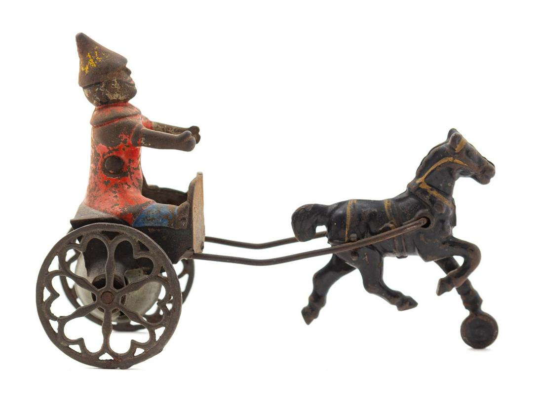 A Gong Bell Co. Horse-Drawn Clown Toy: A Gong Bell Co. Horse-Drawn Clown Toy Height 4 1/2 inches. Property from the Collection of Jonathan Hoffman, Chicago, Illinois