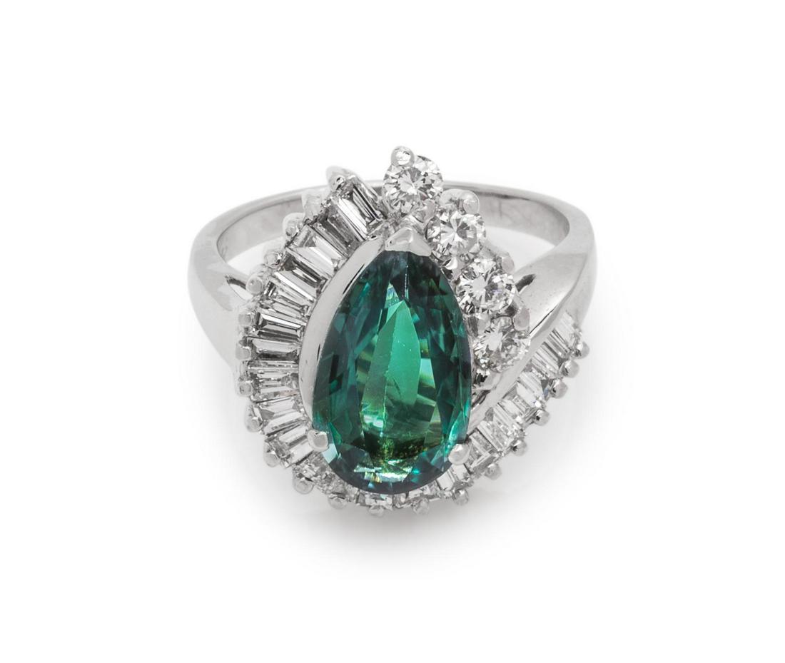 Alexandrite and Diamond Ring: Alexandrite and Diamond Ring containing one pear shape brilliant cut alexandrite weighing 3.01 carats, four round brilliant cut diamonds weighing approximately 0.28 carat total and numerous baguette c