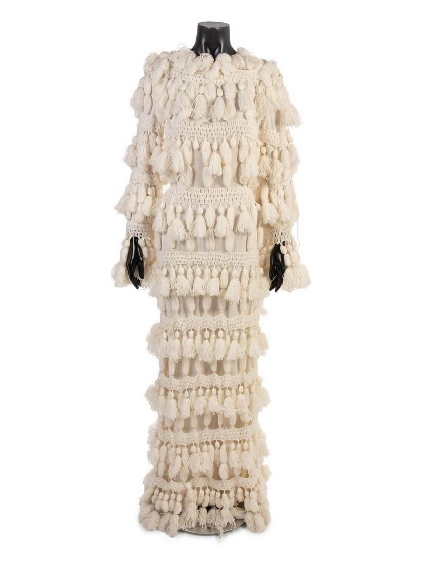 Fausto Sarli Ensemble, c.2000: Fausto Sarli Ensemble, c.2000 White crepe dress with long flared sleeves, scoop neckline, long straight skirt. Dress is embellished white crocheted yarn and white sequins in horizontal rows with tasse