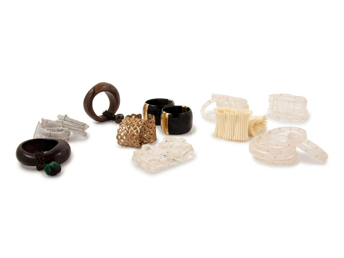 22 Bracelets with 4 Pairs of Earrings, 1970-90s : 22 Bracelets with 4 Pairs of Earrings, 1970-90s This lot includes: -Multiple styles and shapes. All un-stamped. -Three sets of cube shaped Lucite earrings -One set of gunmetal tube earrings. Property 