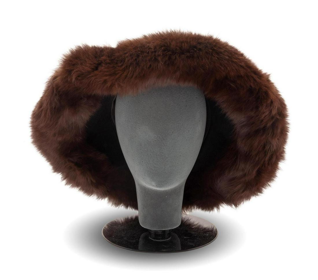 Two B. Michael Hats, 1990s: Two B. Michael Hats, 1990s This lot includes: -Black felt hat with brown fur trim -Black felt wide brimmed hat Label: B. Michael Property From the Ebony Fashion Fair Archive