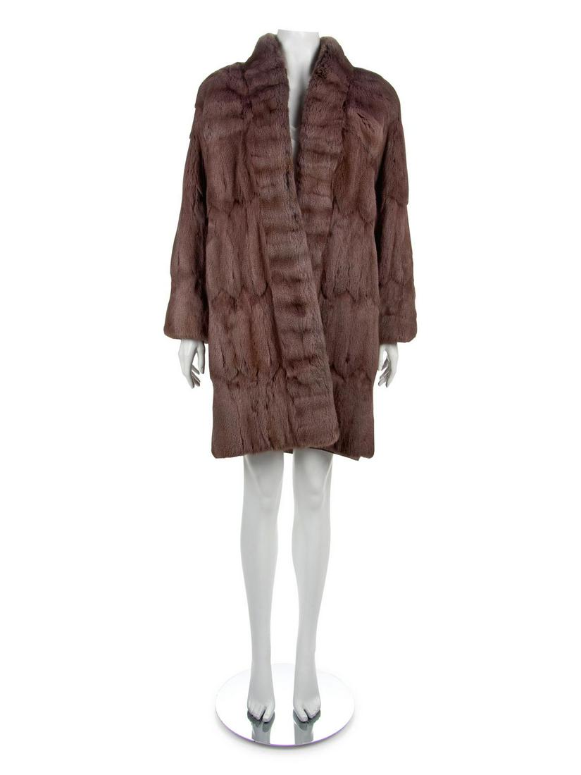 Fendi by Karl Lagerfeld Ermine Coat, 1990-2000s: Fendi by Karl Lagerfeld Ermine Coat, 1990-2000s Mauve ermine coat with stand collar that extends down the center front edges and long sleeves. The center front is without a closure and hangs open. No