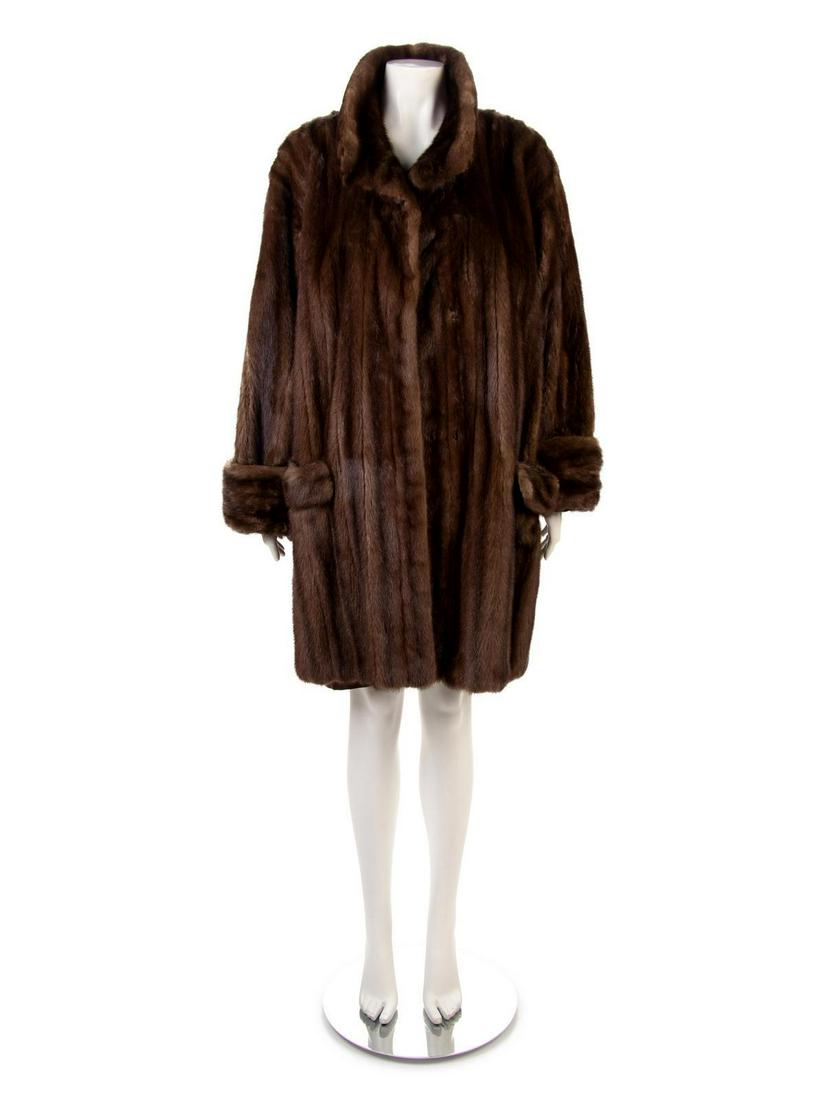 Brown Mink Hip Length Coat, 1980-90s: Brown Mink Hip Length Coat, 1980-90s Brown mink reversible coat with brown silk lining, stand collar, long sleeves, flapped pockets on hips, and center front hook and eye closure. No label No size lab