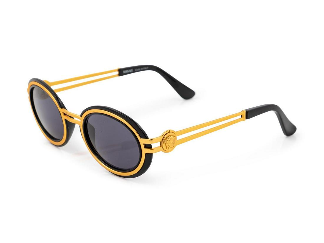 One Christian Dior and One Versace Sunglasses, 1980-90s: One Christian Dior and One Versace Sunglasses, 1980-90s Goldtone sunglasses with black outline on lenses. Stamped: Versace Silvertone sunglasses with 'Dior' spelled on the sides. Stamped: Dior