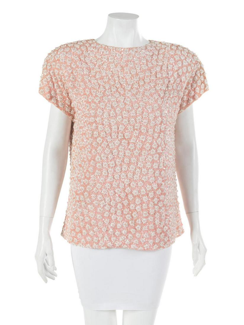 Bill Blass Pink Beaded Top, 1980-90s: Bill Blass Pink Beaded Top, 1980-90s Pink crepe sleeveless top encrusted with pink and white sequins and glass beads in a floral pattern. Label: Bill Blass Size Label: 10 Approximate Flat Measurements
