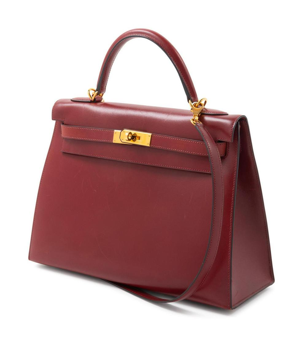 Hermes 30cm Kelly Handbag, c. 2000: Hermes 30cm Kelly Handbag, c. 2000 Gold plated hardware, a detachable shoulder strap, a clochette with lock and keys, a front flap turn lock closure, two interior slip pockets and one interior zip poc