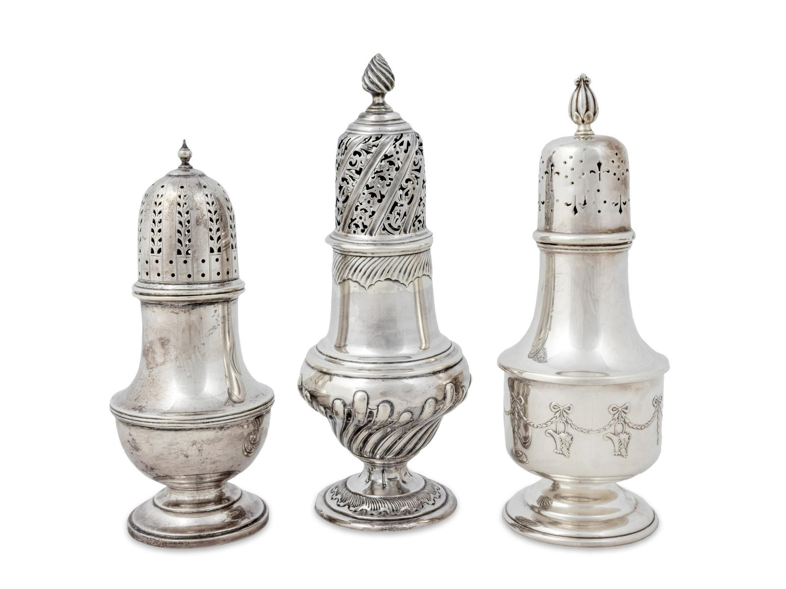 Three English Silver Casters Heights 7 1/4, 9 and 8 1/2: Three English Silver Casters 18th/19th Century Each of traditional form, the first possibly Susanna Barker, London, 1801 (marks rubbed); the second William Gibson and James Langdon, Sheffield, 1889, t