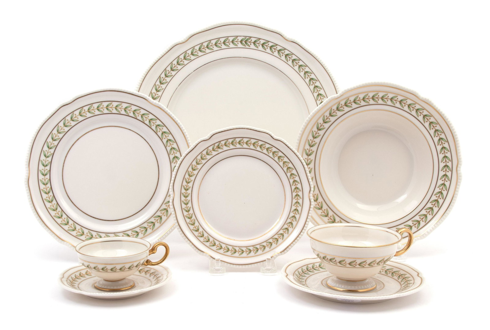 An American Porcelain Part Dinner Service Diameter of: An American Porcelain Part Dinner Service 20TH CENTURY Comprising: 12 dinner plates 12 salad plates 12 soup bowls 12 bread and butter plates 12 teacups and 12 saucers 11 demitasse cups and 12 saucers 