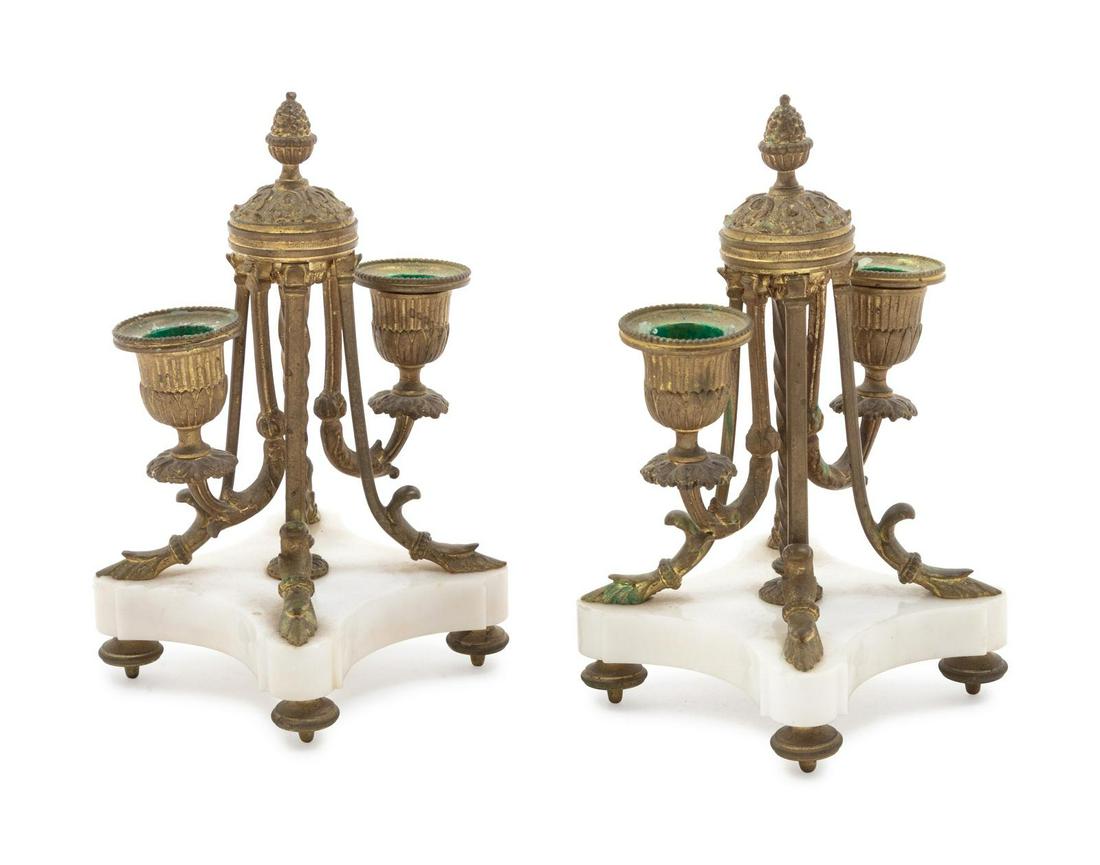 A Pair of Neoclassical Gilt Bronze Two-Light Candelabra: A Pair of Neoclassical Gilt Bronze Two-Light Candelabra Late 19th/Early 20th Century Height 7 1/2 inches. Property from the Collection of Dr. Gregory Boshart and Dr. William Lawrence, Chicago, Illinoi