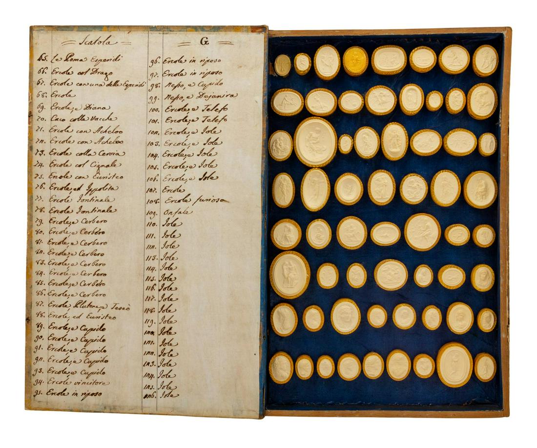 A Collection of Grand Tour Plaster Intaglios: A Collection of Grand Tour Plaster Intaglios 19th Century Height of case 13 x width 8 1/4 inches.