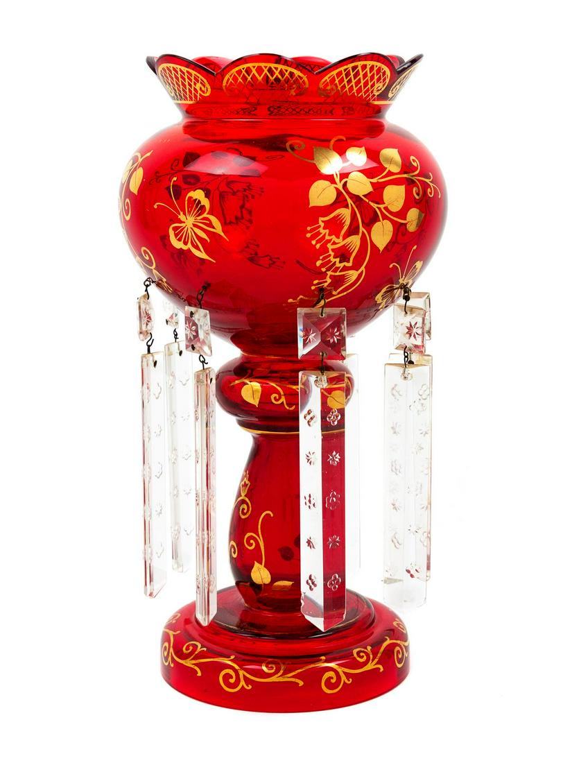 A Bohemian Gilt-Decorated Ruby and Cut Glass: A Bohemian Gilt-Decorated Ruby and Cut Glass Candleholder Height 12 1/2 inches. Property from the Collection of Michael and Janice Doniger, Chicago, Illinois