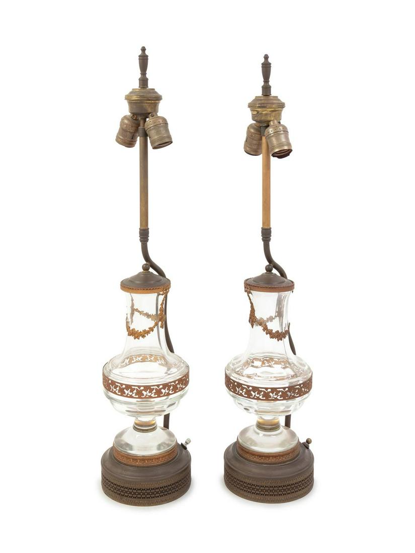 A Pair of Gilt Metal Mounted Glass Jars: A Pair of Gilt Metal Mounted Glass Jars Early 20th Century each mounted as lamps. Height overall 24 3/4 inches. Property from the Collection of Dr. Gregory Boshart and Dr. William Lawrence, Chicag