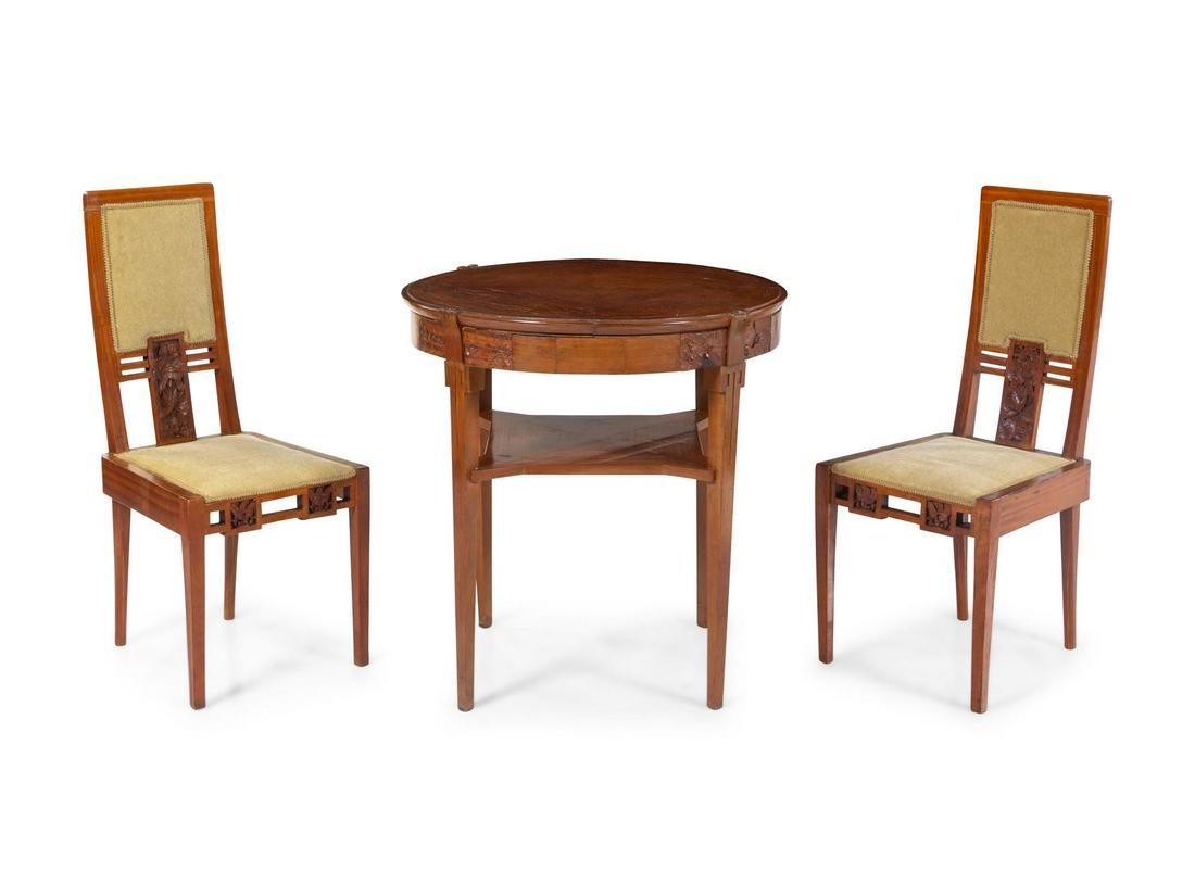 A Late Art Nouveau Table and Chairs: A Late Art Nouveau Table and Chairs Early 20th Century comprising a table and two chairs.