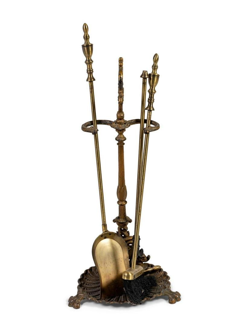 A Set of Brass Fireplace Tools Length of longest 33: A Set of Brass Fireplace Tools Length of longest 33 inches.