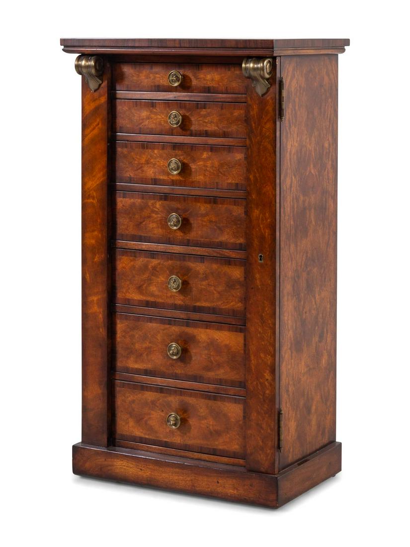 An English Burlwood Wellington Chest: An English Burlwood Wellington Chest 20th Century Height 42 1/4 x width 22 3/4 x depth 16 inches. Property from the Collection of Dr. Gregory Boshart and Dr. William Lawrence, Chicago, Illinois