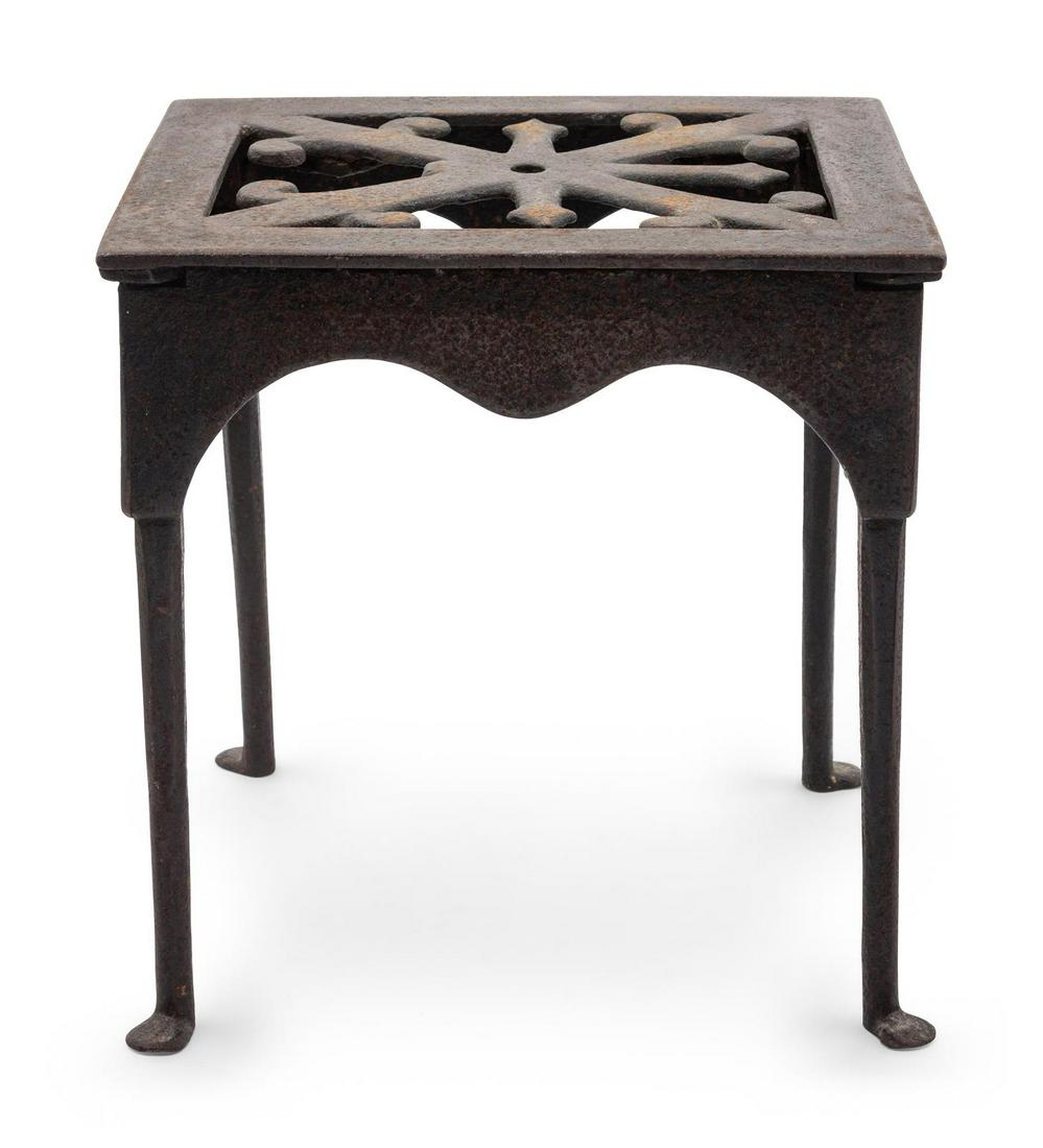 A Wrought and Cast Iron Kettle Stand: A Wrought and Cast Iron Kettle Stand 18th Century Height 11 1/4 inches. Property from the Collection of Michael and Janice Doniger, Chicago, Illinois