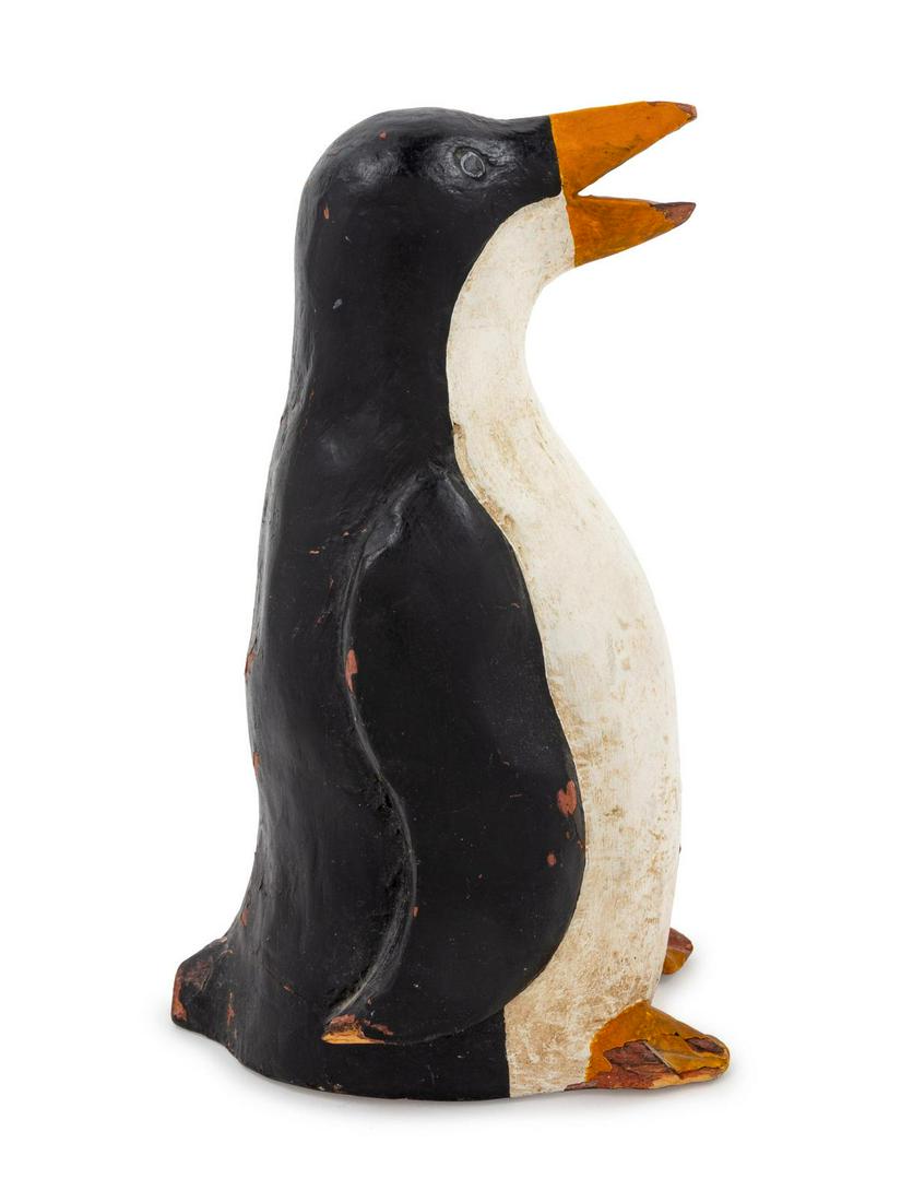 A Carved and Painted Wood Penguin: A Carved and Painted Wood Penguin American, First Half 20th Century Height 9 3/4 inches. Property from the Collection of Michael and Janice Doniger, Chicago, Illinois