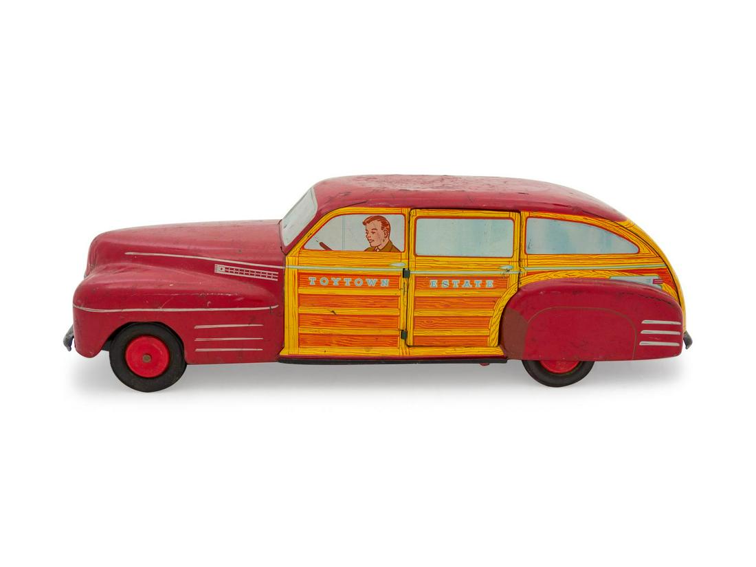 A Wyandotte Tin ToyTown Express Car: A Wyandotte Tin ToyTown Express Car Length 21 inches. Property from the Collection of Michael and Janice Doniger, Chicago, Illinois