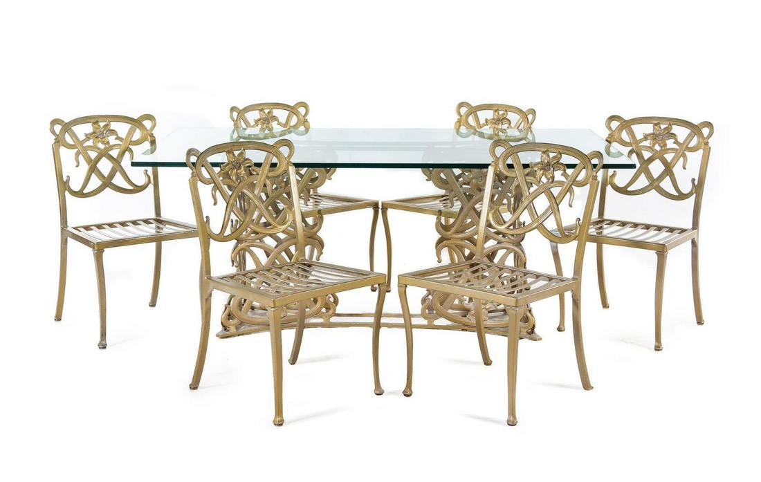A Gilt Metal and Glass Dining Table: A Gilt Metal and Glass Dining Table Second Half 20th Century together with six dining chairs. Height of table 29 x length 74 x width 42 inches. Property from the Helen Simons Trust, Chicago, Illinois
