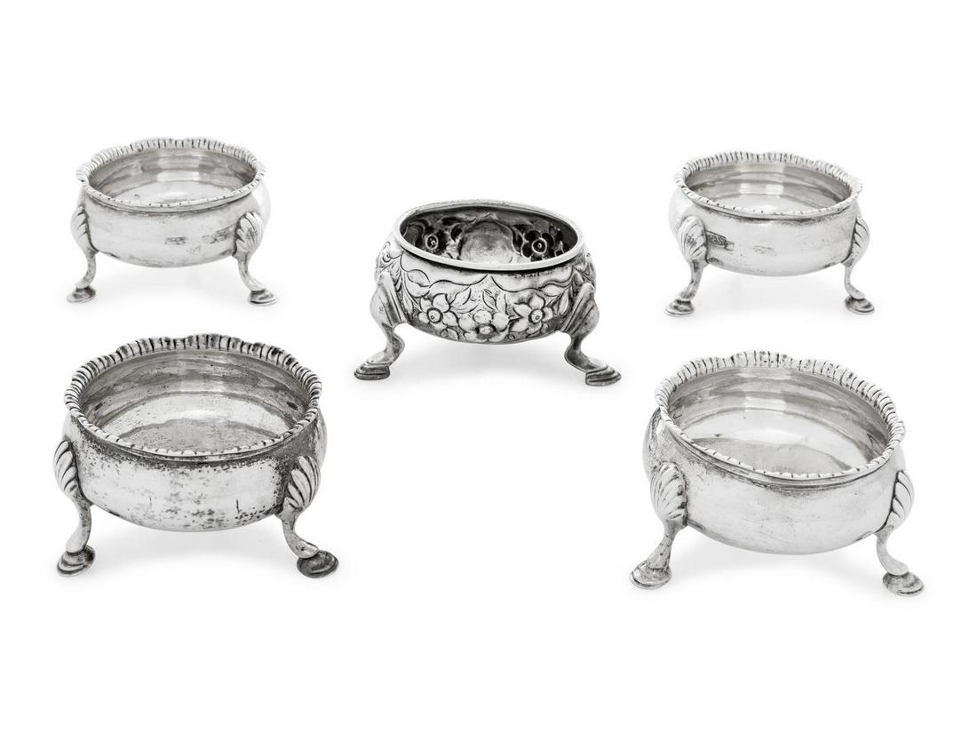 A Set of Four George III Silver Salt Cellars: A Set of Four George III Silver Salt Cellars D & R Hennell, London, 1768 together with an example having floral repousse decoration. each hallmarked for Sterling on underside 8 ozt 12 dwts Width 2 3/4