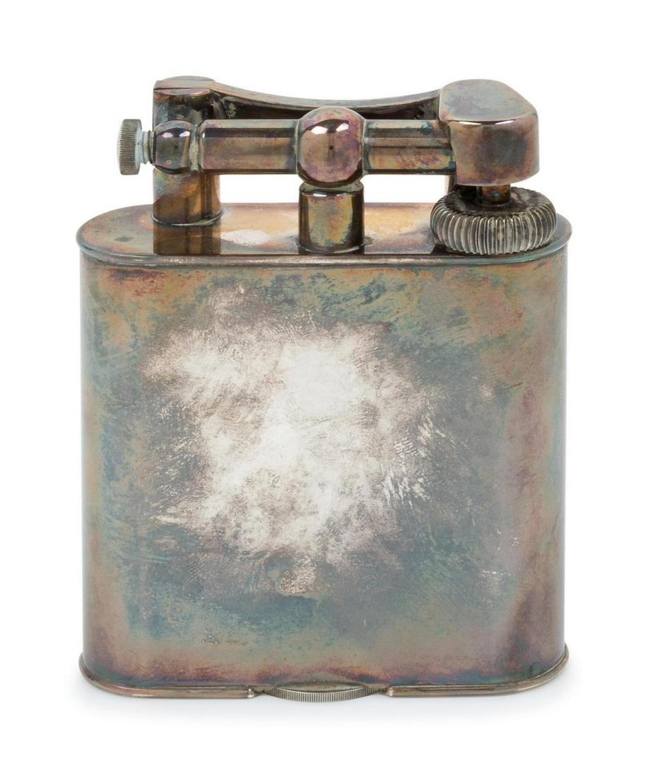 A Dunhill Silver-Plate Lift-Arm Table Lighter: A Dunhill Silver-Plate Lift-Arm Table Lighter First Half 20th Century Height 4 1/4 inches. Property from a Midwest Collector
