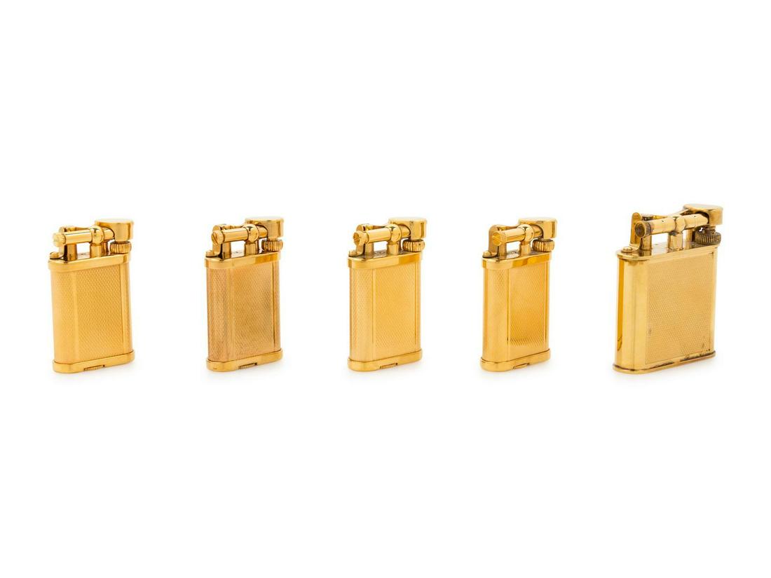 A Group of Five Gilt Metal Dunhill Lift-Arm Lighters: A Group of Five Gilt Metal Dunhill Lift-Arm Lighters 20th Century Property from a Midwest Collector