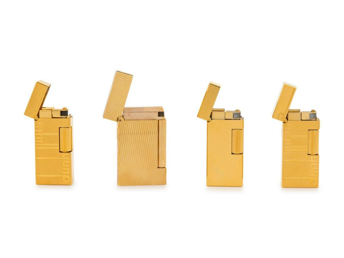 A Group of Four Dunhill Gilt Metal Lighters: A Group of Four Dunhill Gilt Metal Lighters 20th Century Height of tallest 2 1/8 inches. Property from a Midwest Collector