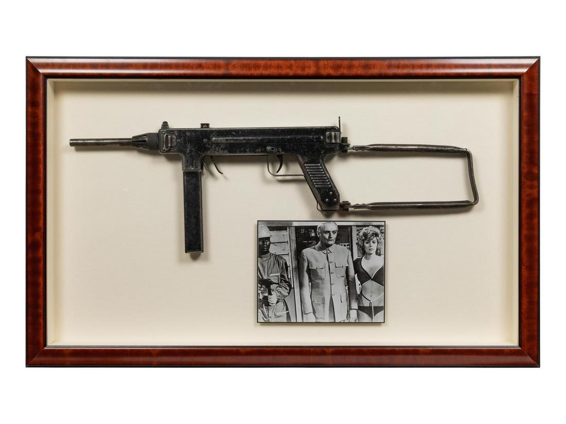 A Diamonds Are Forever (United Artists, 1971) Madsen: A Diamonds Are Forever (United Artists, 1971) Madsen M50 Prop Submachine Gun framed with a still photo from the set. Frame: 23 x 38 inches. Property from an Important Private Collection