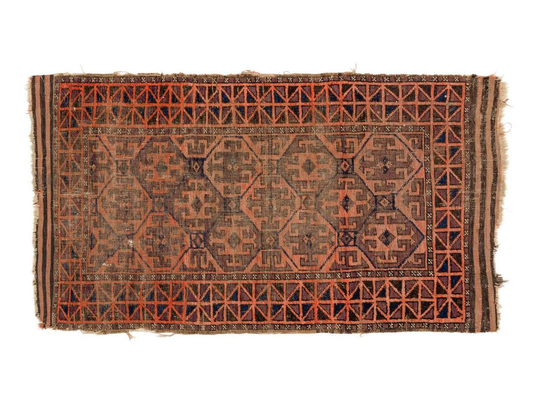 A Baluchi Wool Rug: A Baluchi Wool Rug 4 feet 5 inches x 2 feet 7 1/2 inches. Property from the Collection of Dr. Gregory Boshart and Dr. William Lawrence, Chicago, Illinois