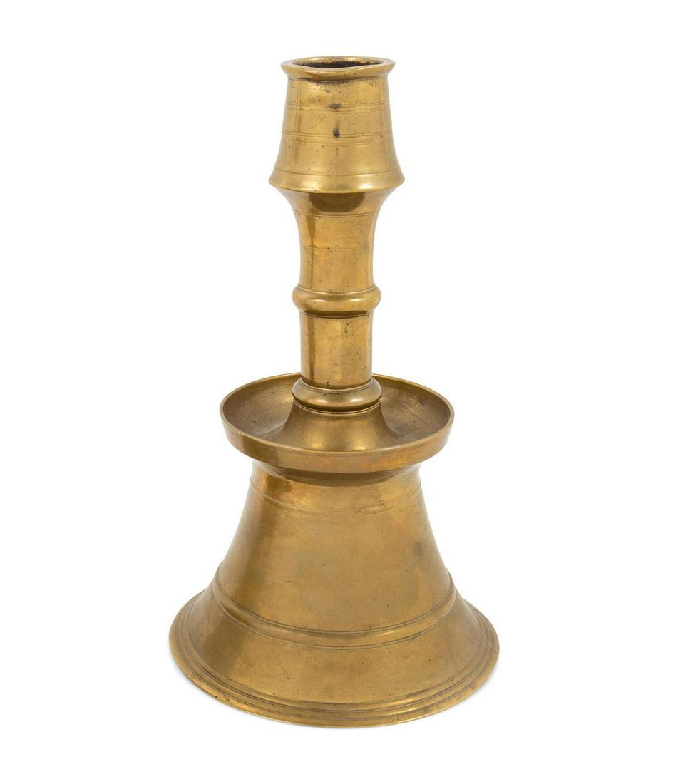 An Ottoman Cast Brass Lathe Turned Candlestick: An Ottoman Cast Brass Lathe Turned Candlestick. Likely 16th/17th Century commissioned by Rustum. Height 12 1/2 inches Property from the Collection of Hamid and Kim Alwan, Milwaukee, Wisconsin