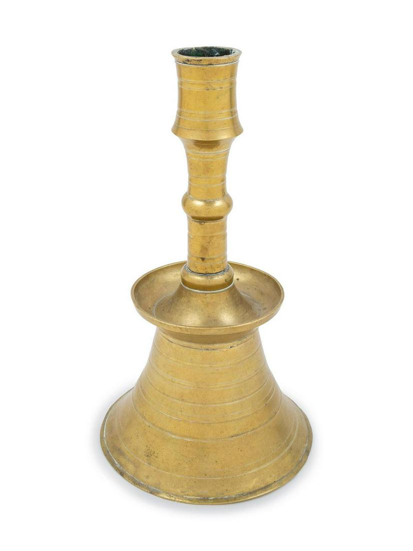 An Ottoman Cast Brass Lathe-Turned Candlestick: An Ottoman Cast Brass Lathe-Turned Candlestick Likely 17th Century Height 12 inches. Property from the Collection of Hamid and Kim Alwan, Milwaukee, Wisconsin