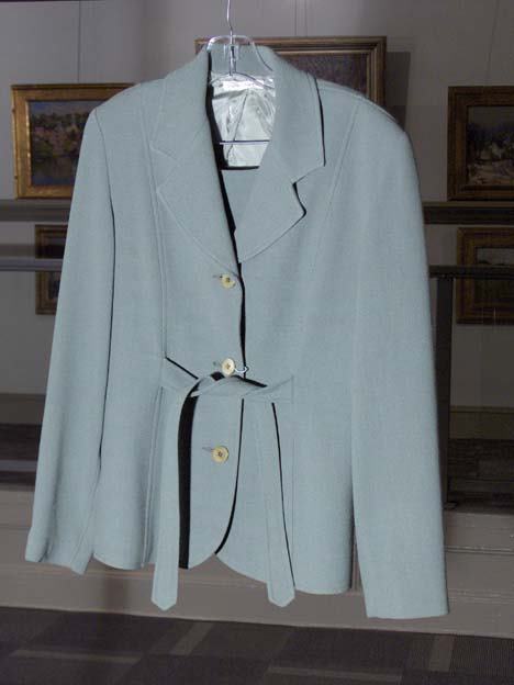 822: STEPHEN DIGERONIMO GREEN WOOL SKIRT SUIT With atta: STEPHEN DIGERONIMO GREEN WOOL SKIRT SUIT With attached belt (to tie in back) and short wrap skirt, size 10. Together with a Morabito light blue tweed plaid blazer and coordinating blue slacks, size 46